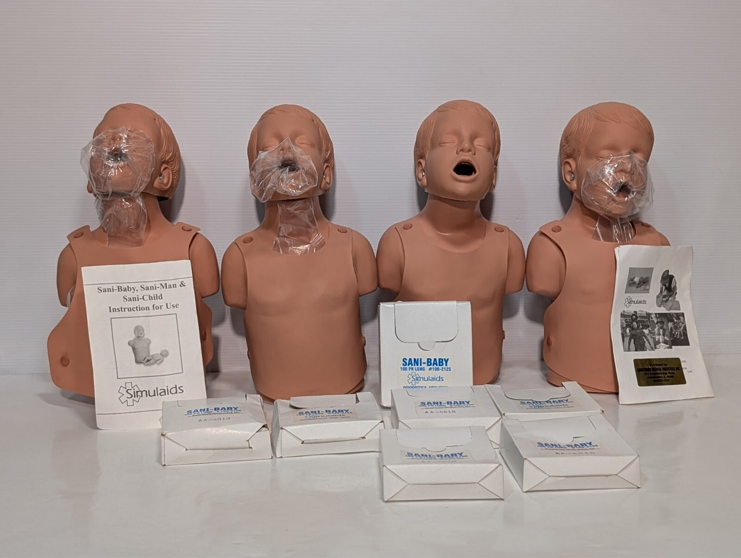 (1) SIMULAIDS SANI-Child CPR Child Training Manikin w/ 100 Pack Lungs as shown