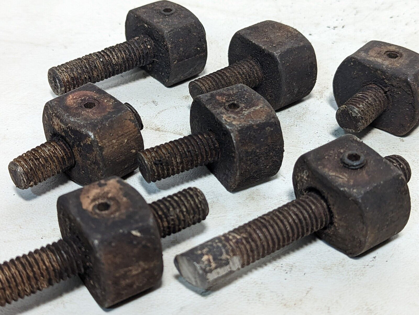 Lot of 8 rusty sawed-off threaded rods with set screw stops as pictured