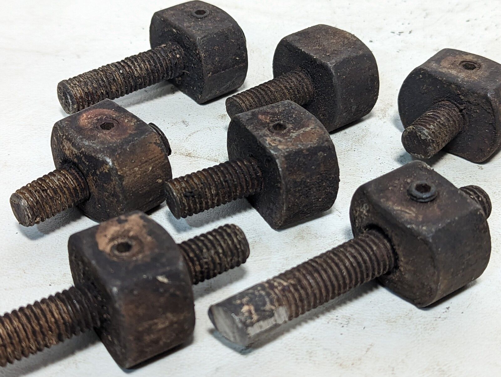 Lot of 8 rusty sawed-off threaded rods with set screw stops as pictured