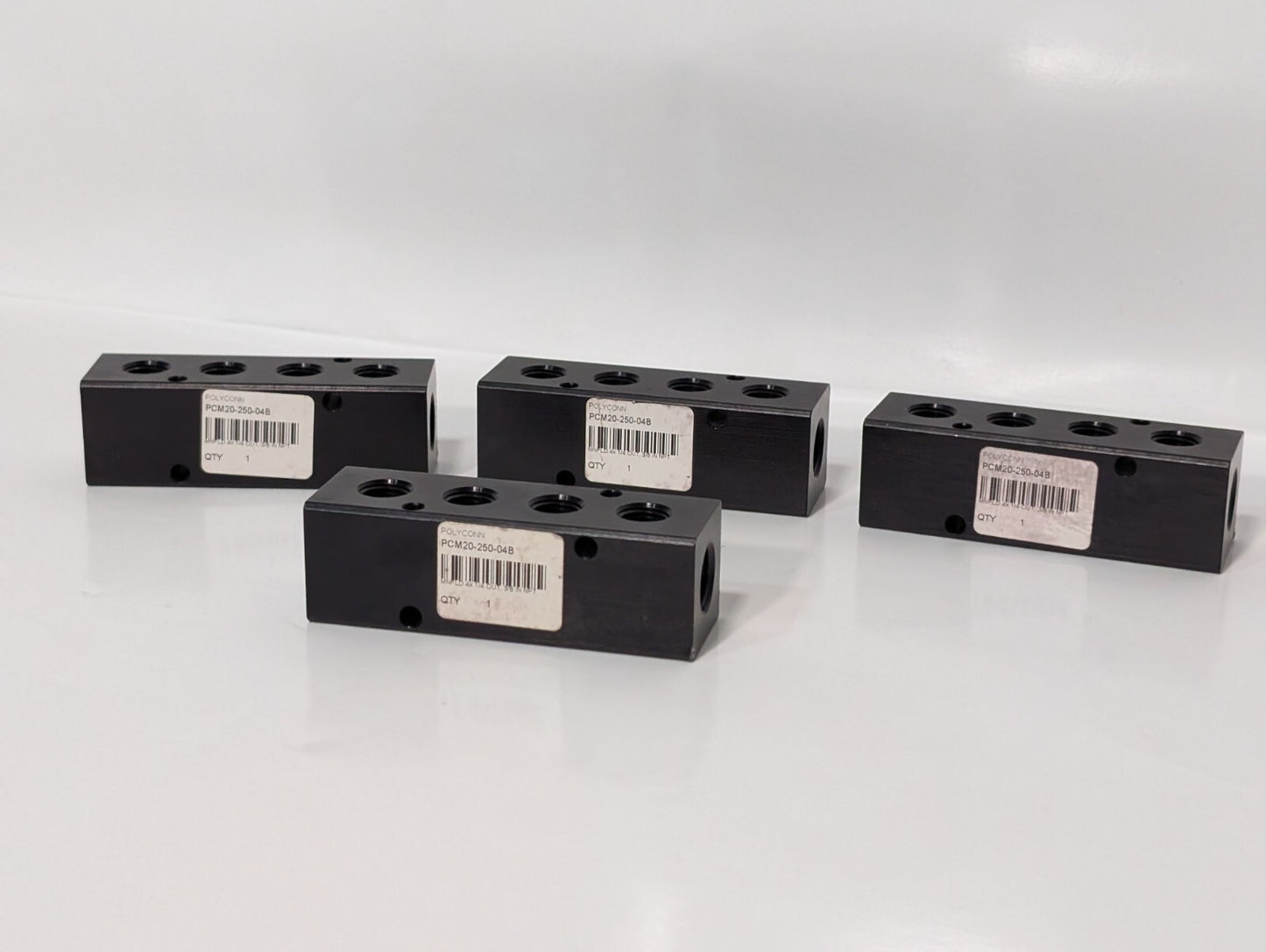 (4) Polyconn PCM20-250-04B Pneumatic Manifold 4x 1/4" NPT Out 3/8" NPT In