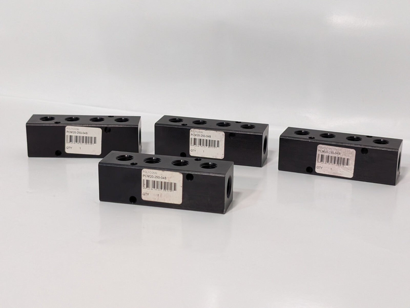 (4) Polyconn PCM20-250-04B Pneumatic Manifold 4x 1/4" NPT Out 3/8" NPT In
