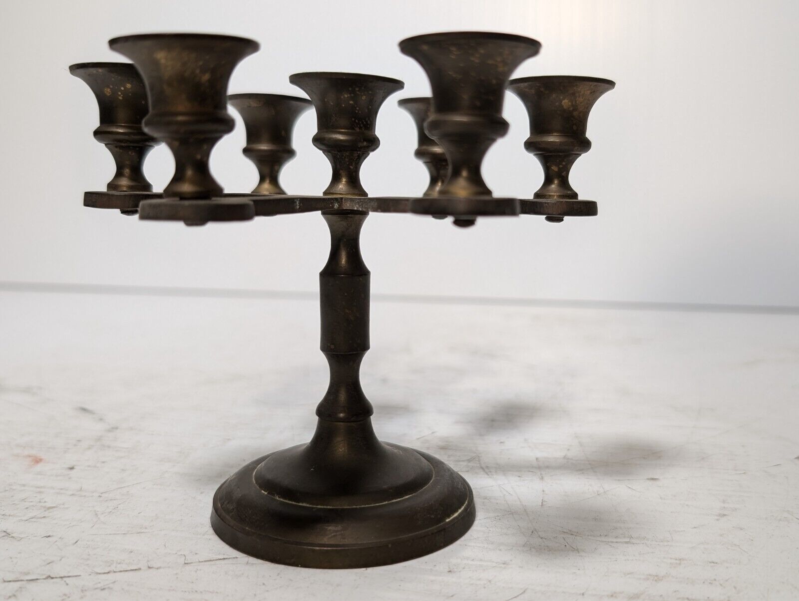 Vintage brass candelabra with seven candleholders, 4.5" tall x 5.5" in diameter
