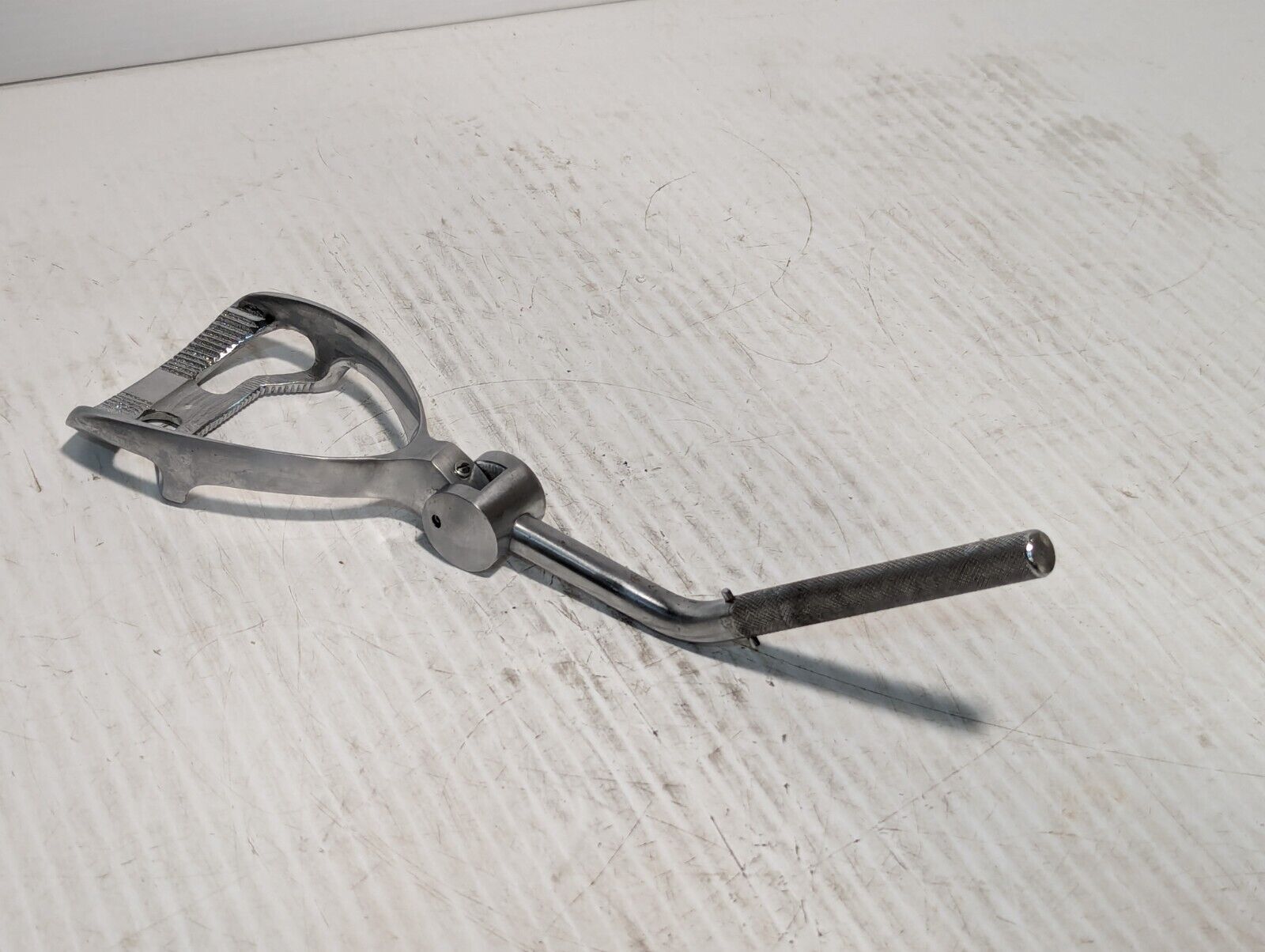 Unbranded stirrup foot rest as pictured, stainless steel, w/cross-hatched grip