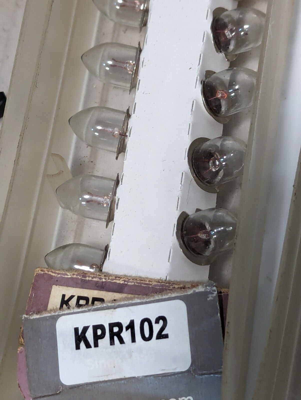 Large lot of assorted small light bulbs: GE 387, KPR102, MPL 410AH, 60PSR, more