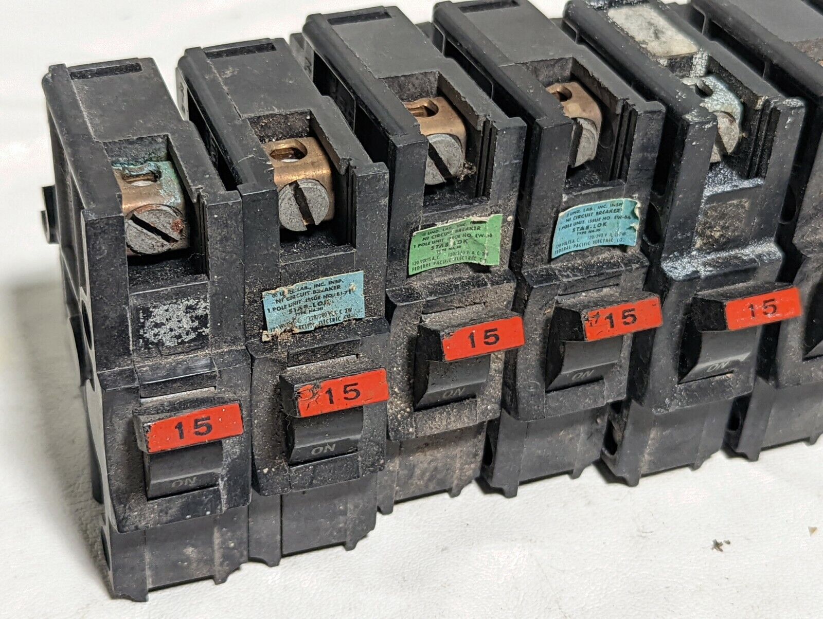 Lot of 11 dirty Federal Pacific NA115 circuit breakers, NA-NI, 15A, 120/240VAC