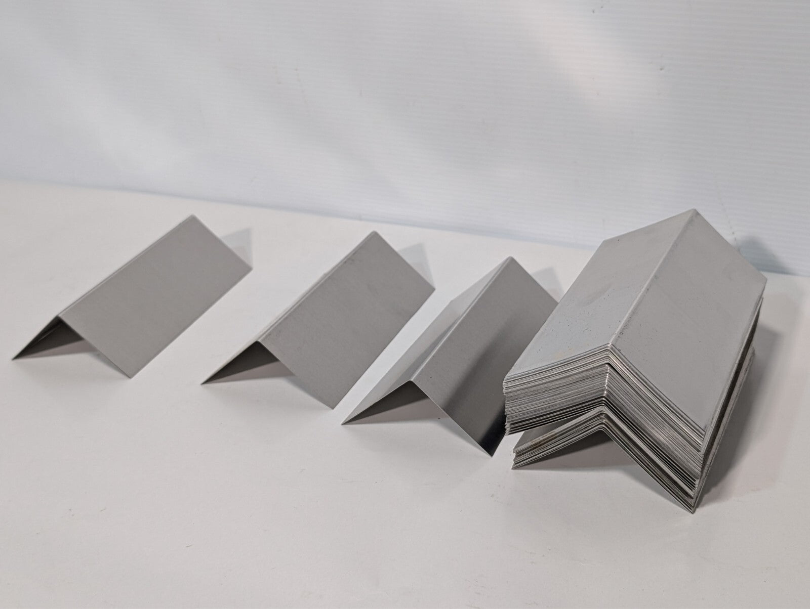 (130) Aluminum 7 inch x 2.5 inch x 2.5 inch bent, for flashing, signs, as shown