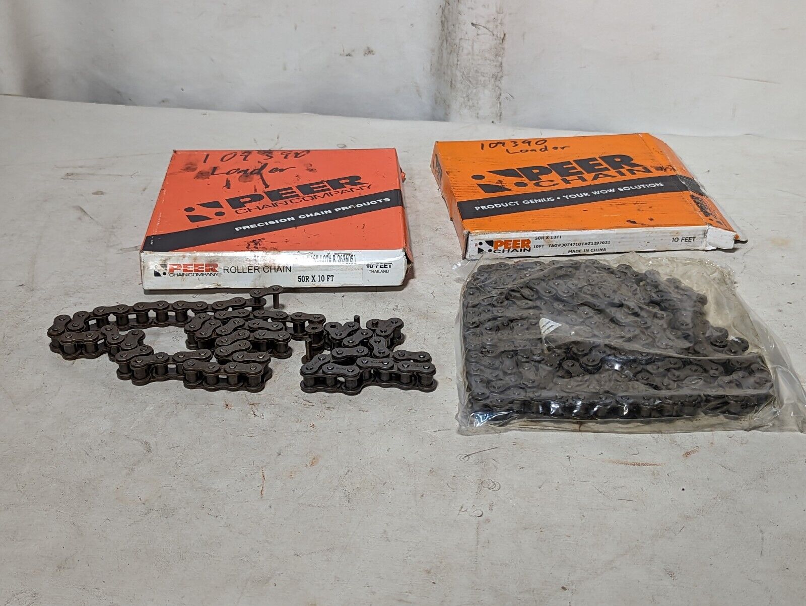 Lot of two boxes of Peer 50R roller chain, 1 10ft box, 1 shorter box as pictured