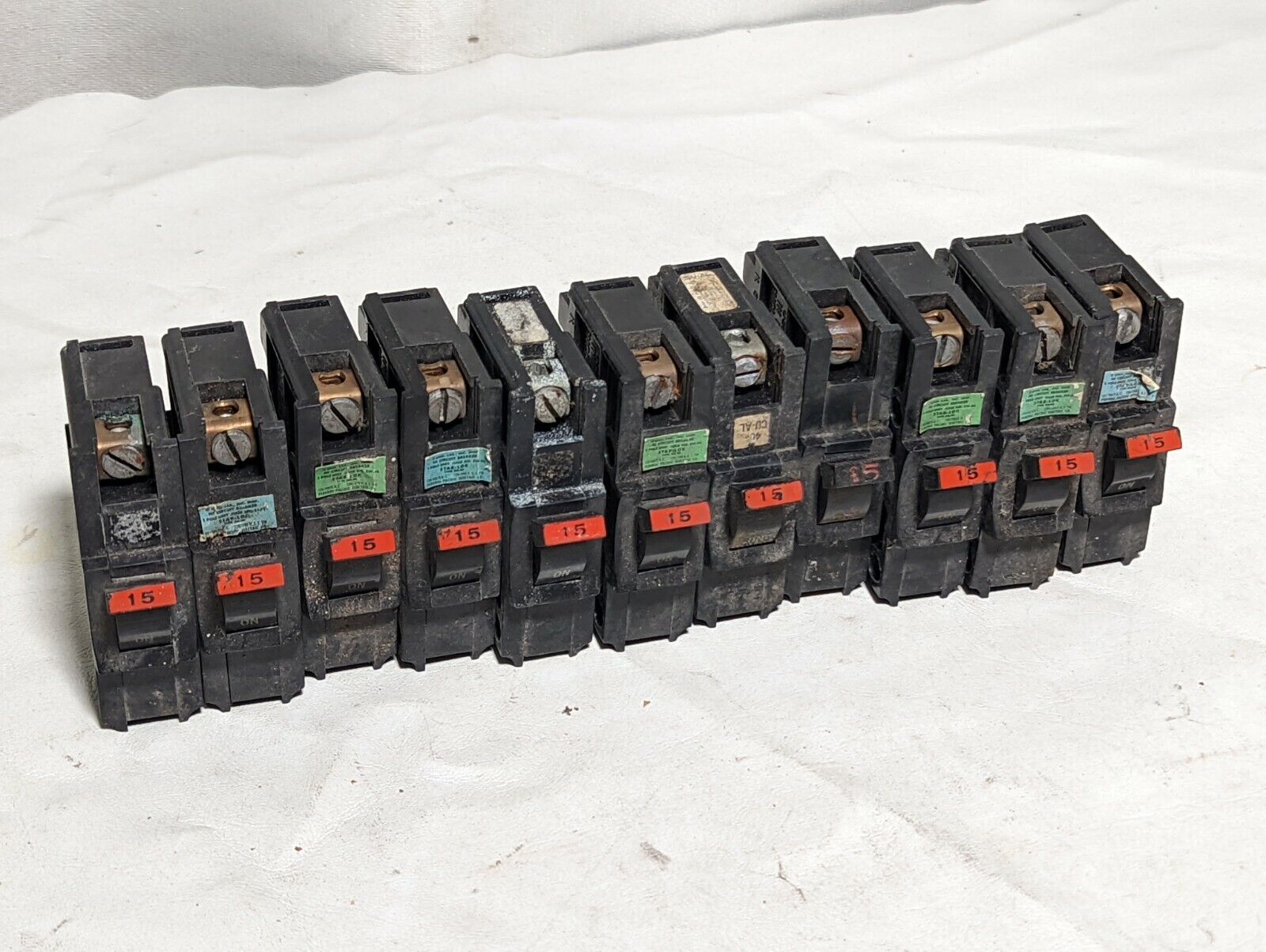 Lot of 11 dirty Federal Pacific NA115 circuit breakers, NA-NI, 15A, 120/240VAC