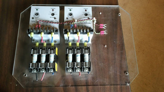 Two TimeMark B264 3-Phase Power Monitors mounted on plastic