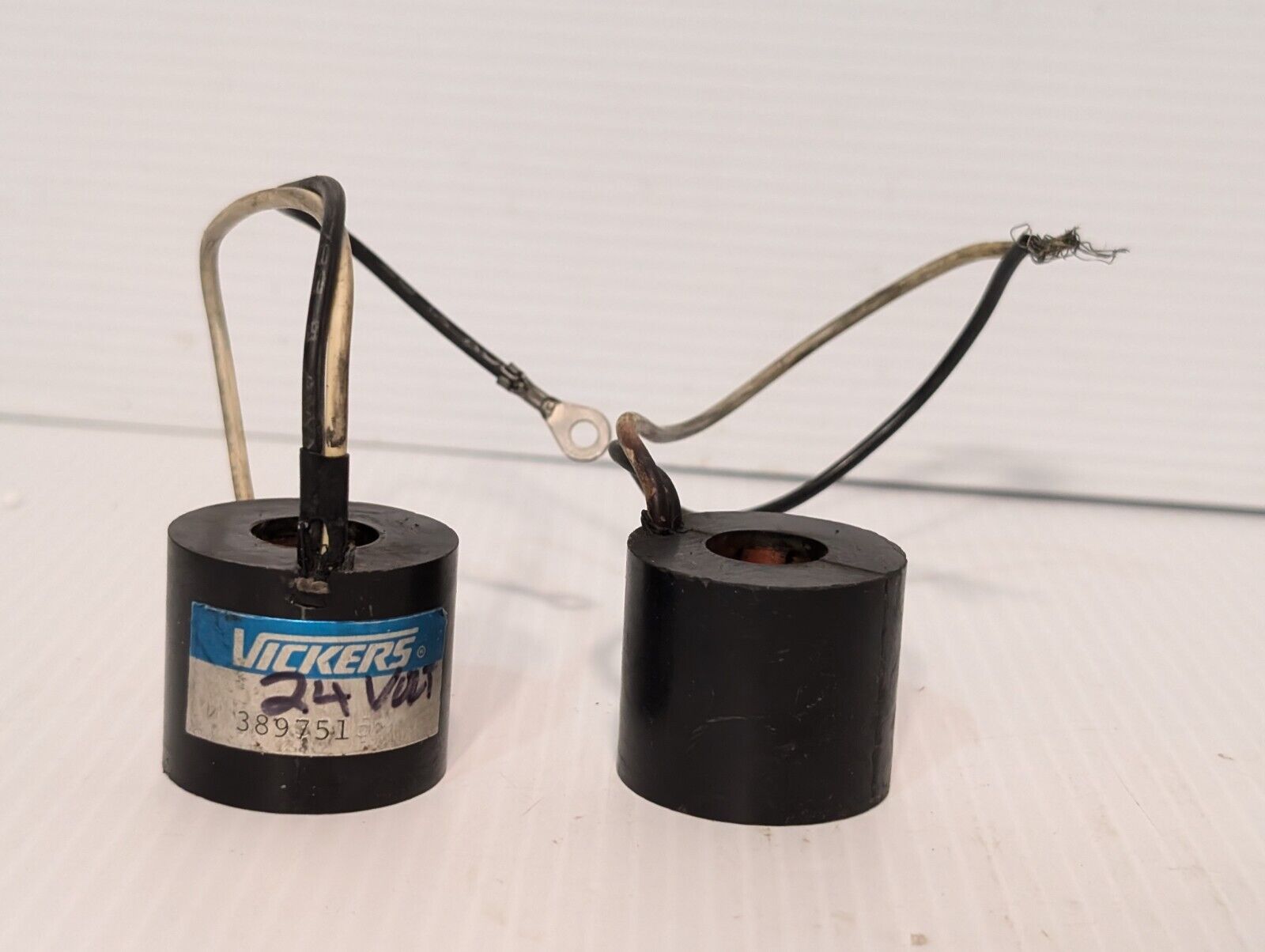 Vickers 389751 solenoid coil, 24V, and another presumably the same, but unmarked