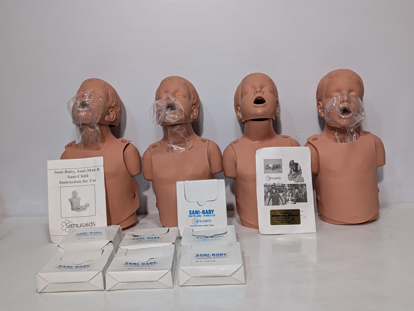 (1) SIMULAIDS SANI-Child CPR Child Training Manikin w/ 100 Pack Lungs as shown