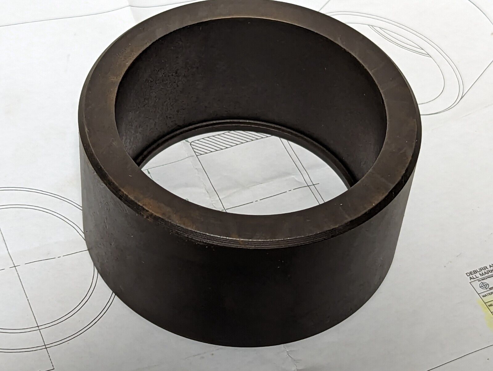 Bushing: 4 inch OD, 3 inch ID, 2 inches wide, 4140 prehard, RC45-50 heat treat, 