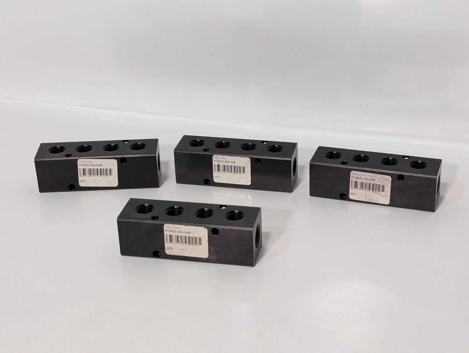 (4) Polyconn PCM20-250-04B Pneumatic Manifold 4x 1/4" NPT Out 3/8" NPT In