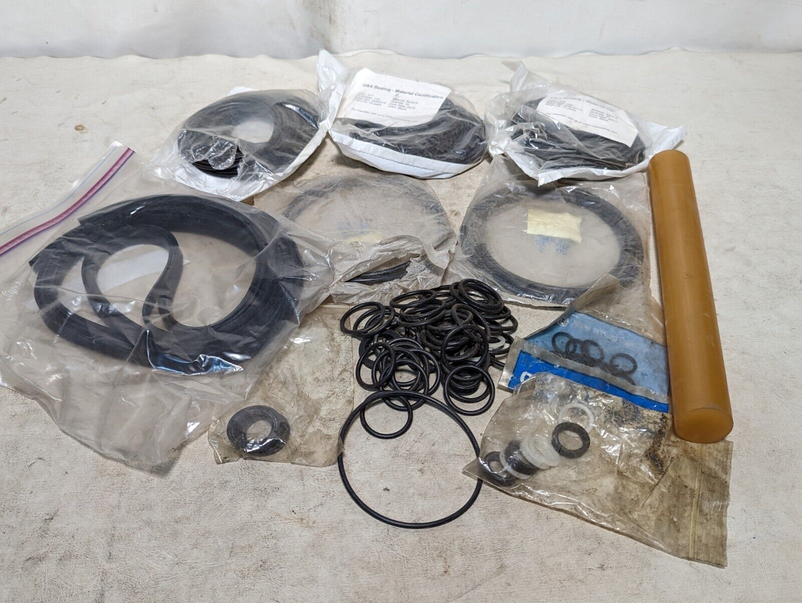 Lot of rubber, Buna N O-rings, rubber straps, and a rubbery cylinder...